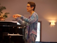 Ruth Huber conducting during 20th Anniversary