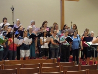 Jenn directing chorus during recording