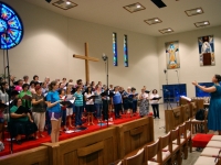 Jenn directing chorus during Katie\'s solo