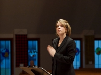 Holly conducting a concert