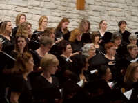 Chorus listens during a pre-concert sound check