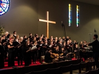 Choir rehearsing with musicians