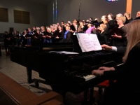 Andrea accompanying choir