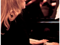 Andrea plays piano during concert