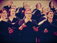 Chorus members singing in the concert